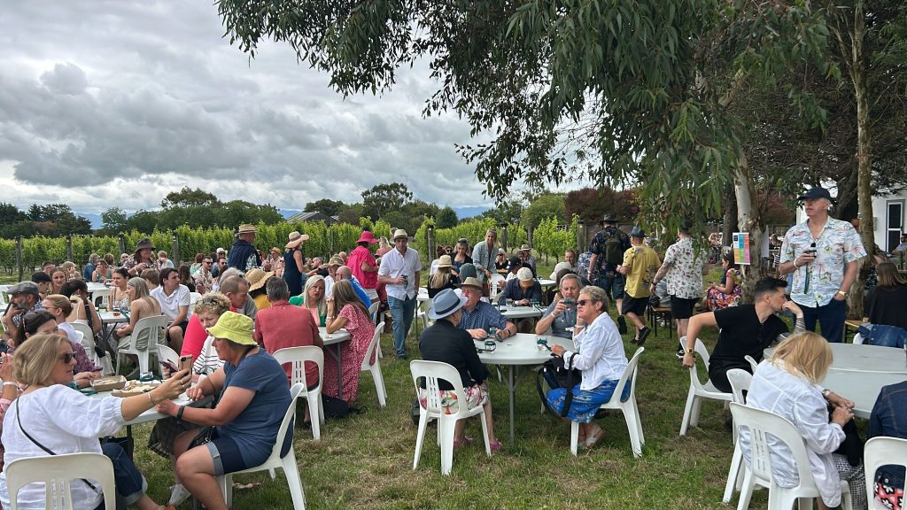 Relaxing outside by the vines at Toast Martinborough 2025 at Tirohana Estate vineyard and restaurant, Martinborough